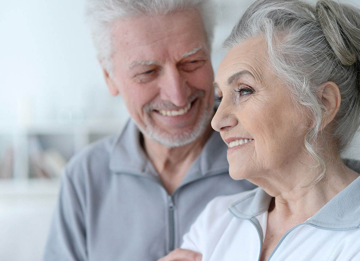 married couple with dental implants in aberdeen